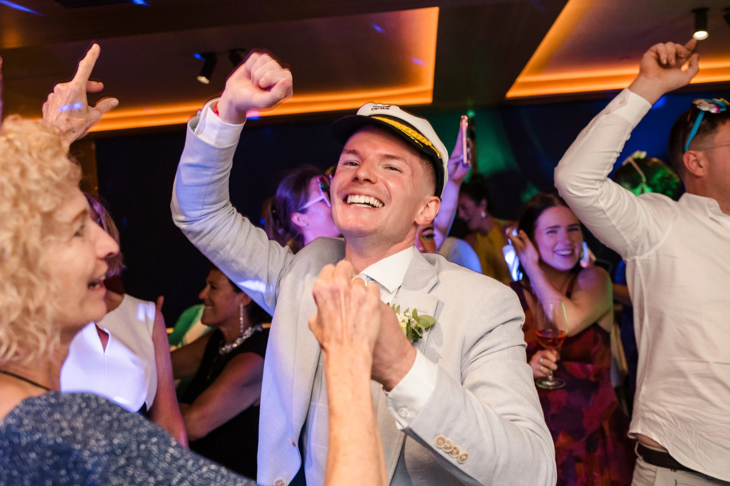 Groom dancing and celebrating with guests at the reception, arms raised in joy. — Wedding at Hotel Only You, Malaga, spain