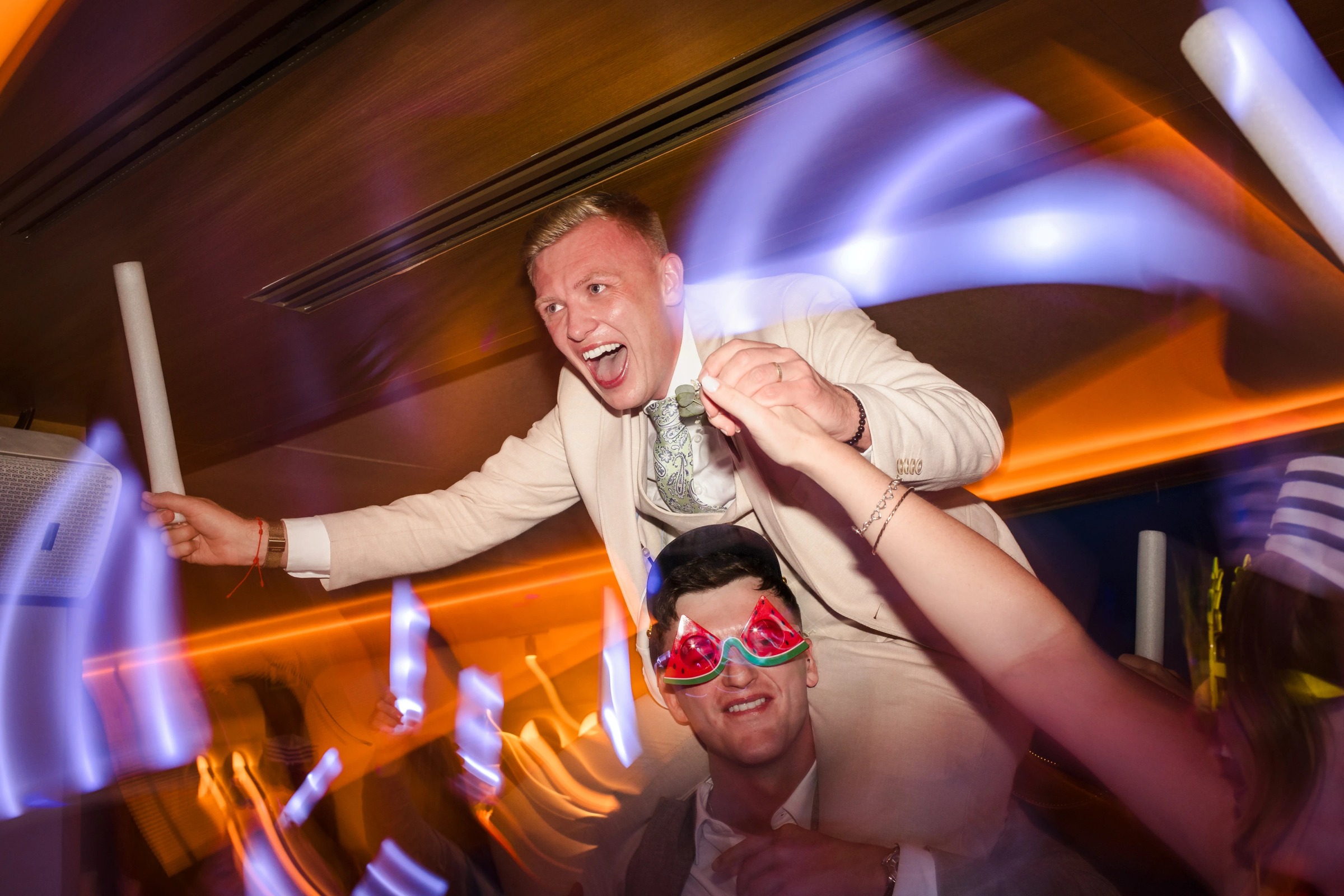 Man and woman dancing energetically at a nightclub, both with arms raised and expressions of joy. — Wedding at Hotel Only You, Malaga, spain