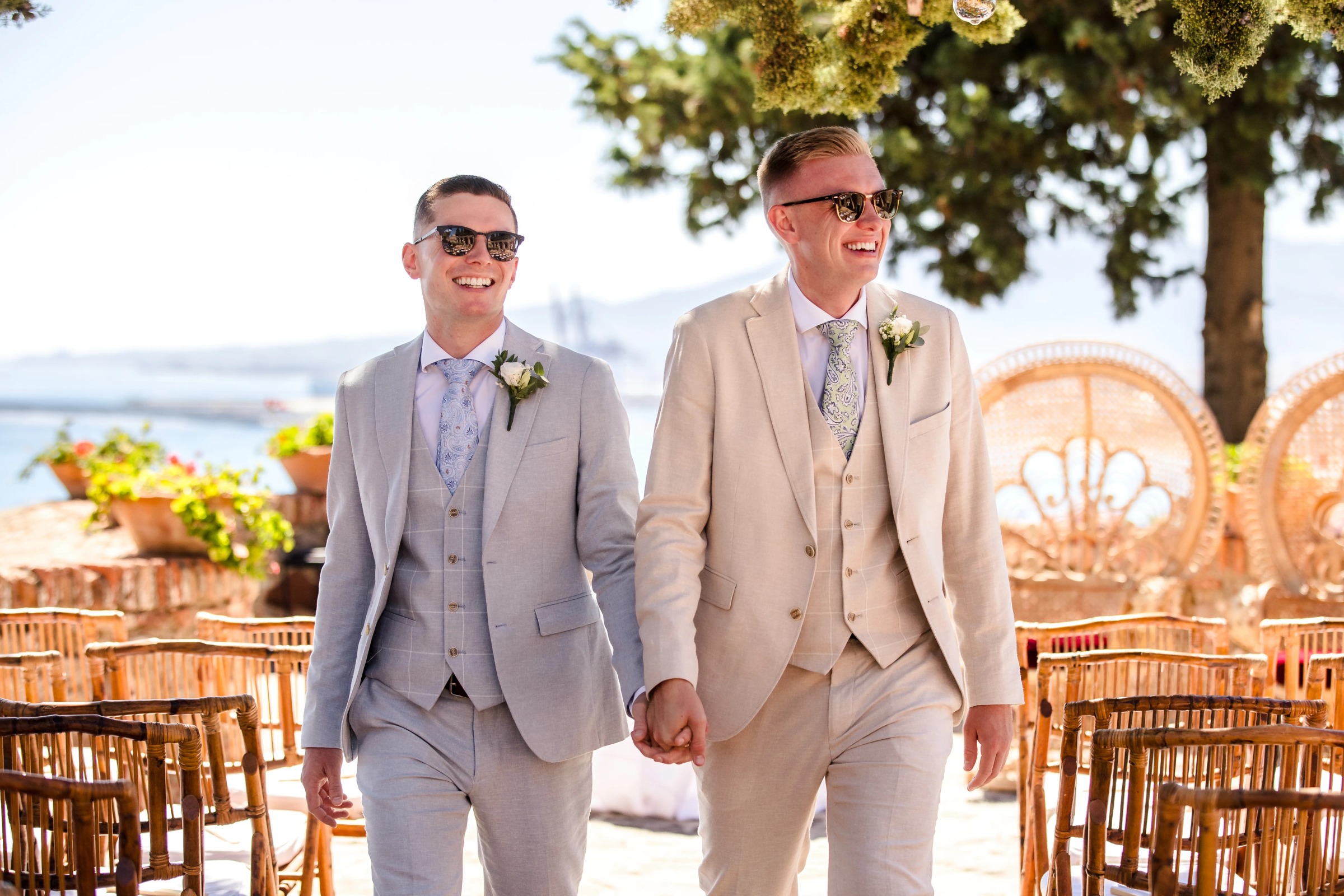 Two grooms walk hand-in-hand down the aisle after their wedding ceremony. — Wedding at Hotel Only You, Malaga, spain
